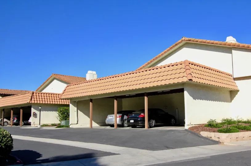 A garage carport with 2 cars in Villa Espanas, Escondido, CA