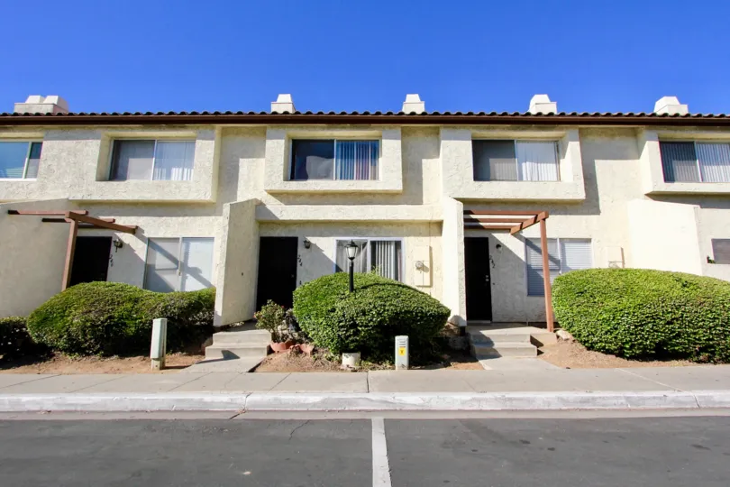 Front doors to apartments and walkways to Villas Espanas in Escondido, Ca.