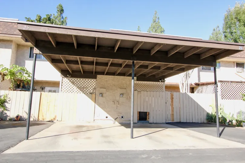 Covered parking area near wooden fence at Villa Grande in Escondido California