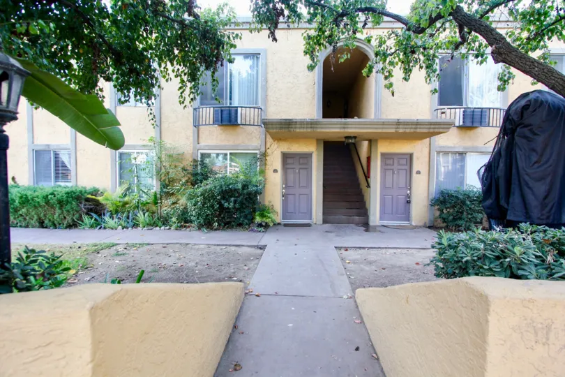 Walkway leading up to two story townhomes at Villa La Paz in Escondido California