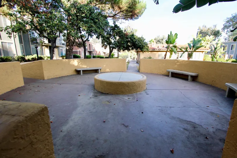 A empty sitting area in a park in Villa La Paz village painted in cream color.