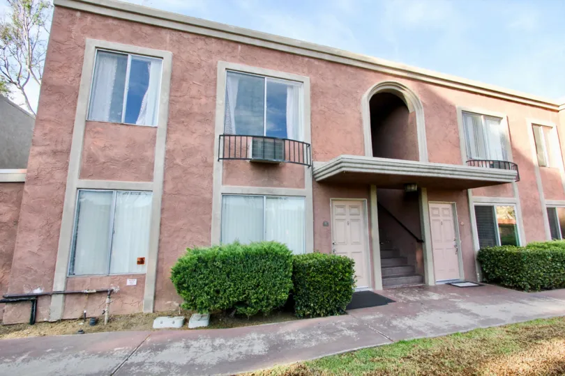 Textured stucco exterior with 2 storey high archway leading to the second floor in Villa La Paz