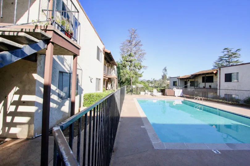 An empty pool in-between houses in Vista del Mundo village.
