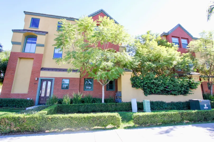 A couple of three story red and brown 12 on Polk homes in Hisscrest CA
