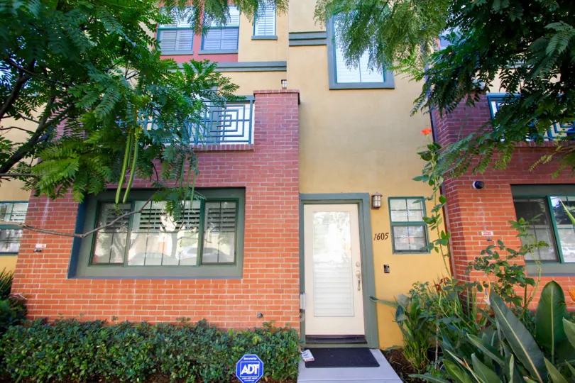 A brick and stucco multi story home in neighborhood of 12 on Polk in Hillcrest California