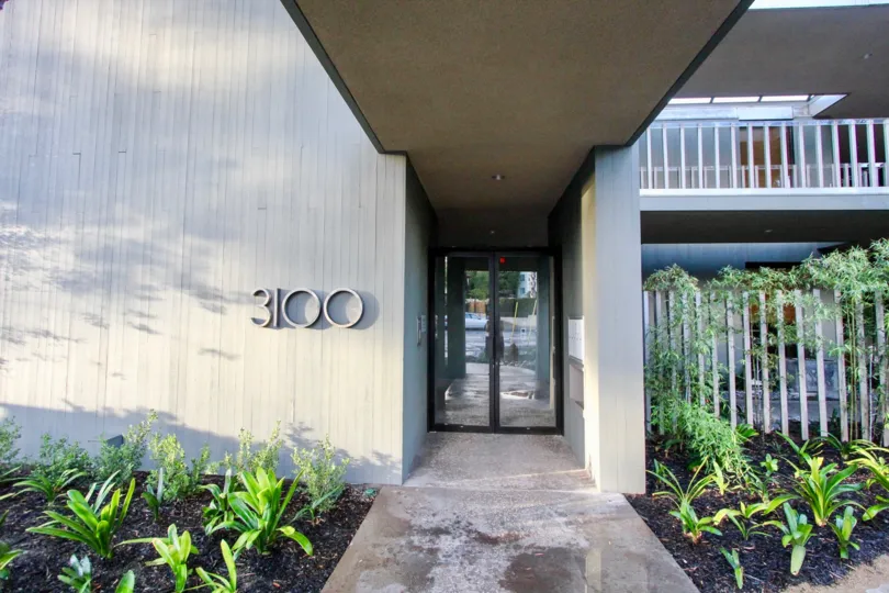A sunny day in the area of 3100 Front, entrance, condo, balcony, house number, door