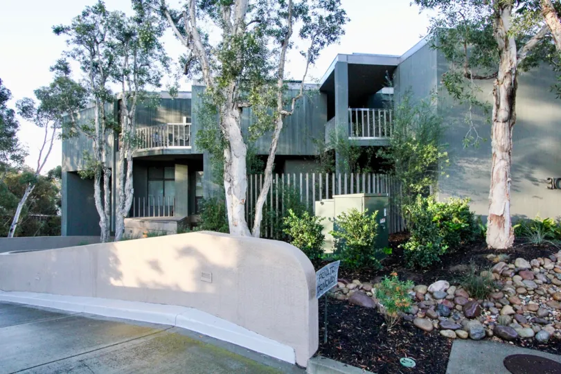 A set of greenish two-storey townhouses in the 3100 Front neighborhood.