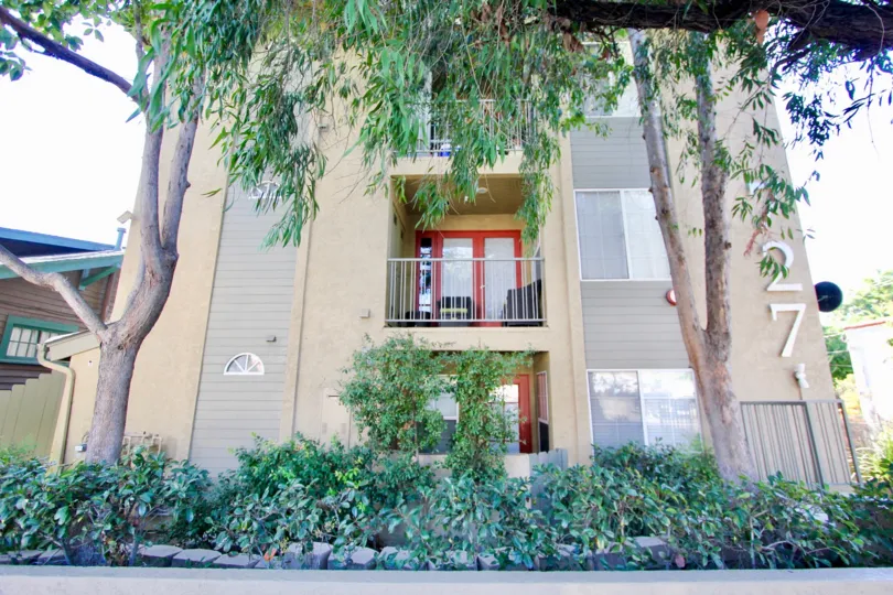 727 Robinson multi-story beige building with patios Hillcrest California