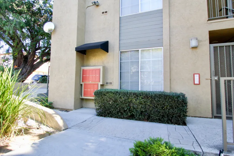 727 Robinson multi-story beige building with patios Hillcrest California