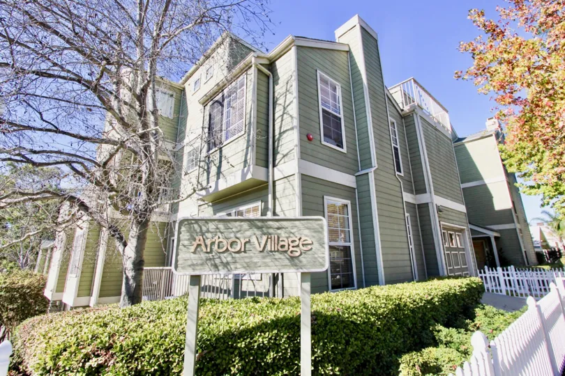 Nice sunny day in Arbor Village with garden and trees near a villa of Hillcrest