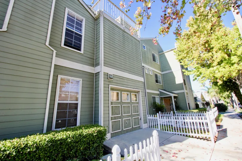 Front of green home in Arbor Village, in Hillcrest, CA