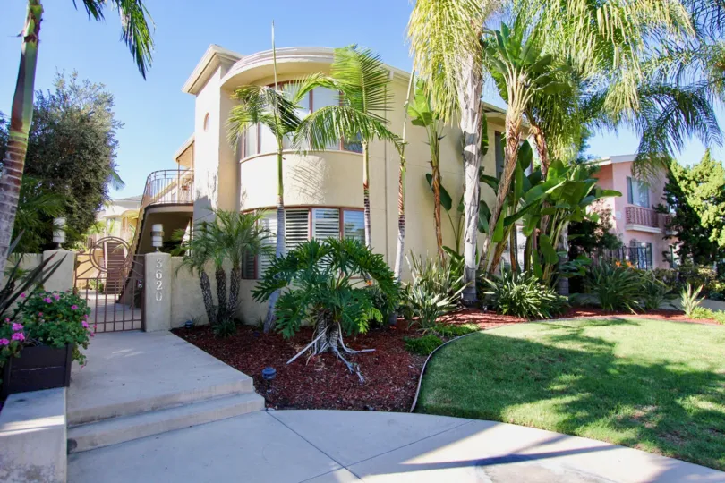 A residence with a curved corner and low gate in the Balboa Court community.