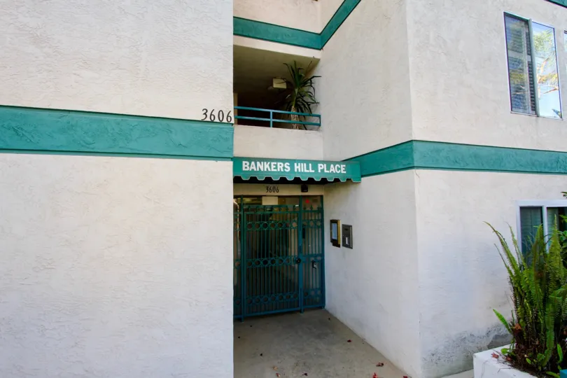 An entrance of a building in the Bankers Hill Place with beautiful plants.