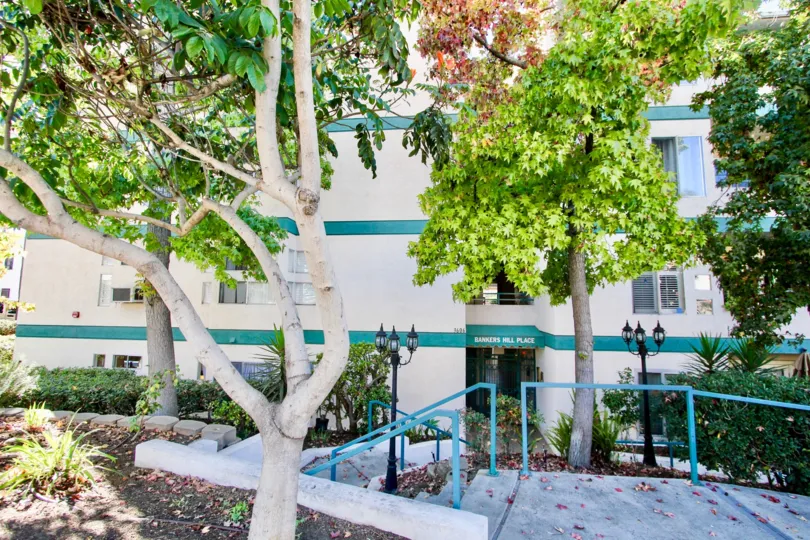 A sunny day in the Bankers Hill Place with residential apartment and trees.