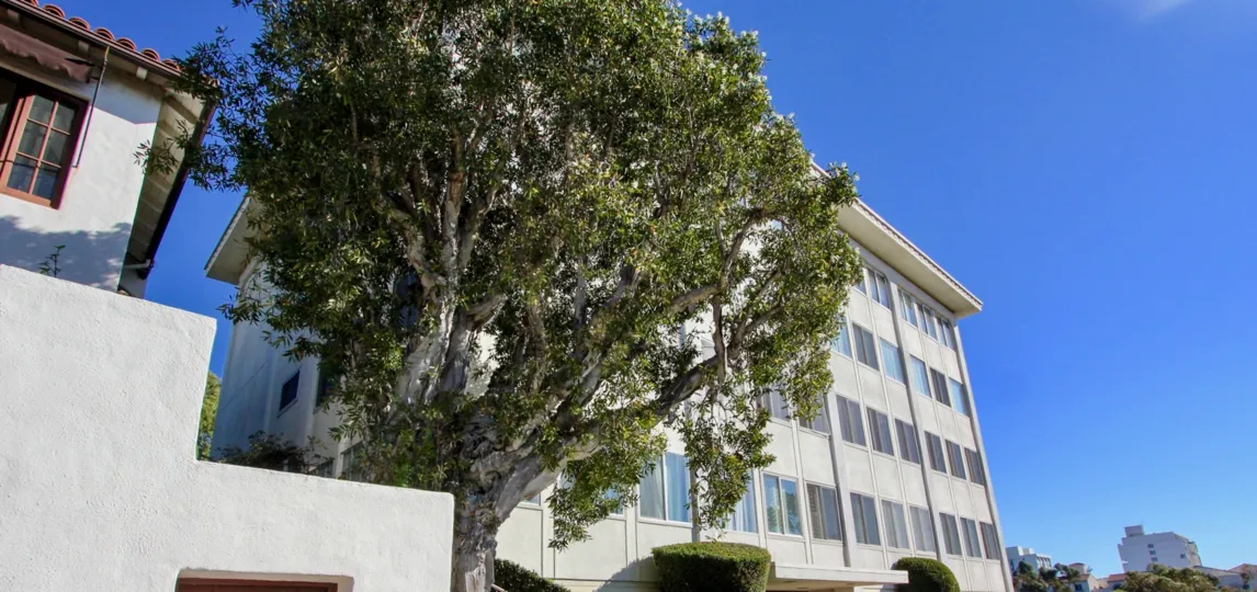 A mid-rise apartment with sliding windows in the Bridge Towers neighborhood.