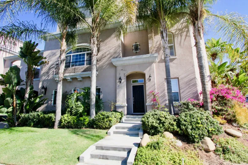 Palm trees, expert landscape, and a beautiful home to top it off at Bristol Square makes anyone want to be in Hillcrest California