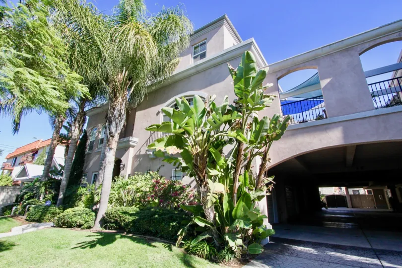 Bright sunny day with lawn and trees with parking in a villa of Bristol Square in Hillcrest