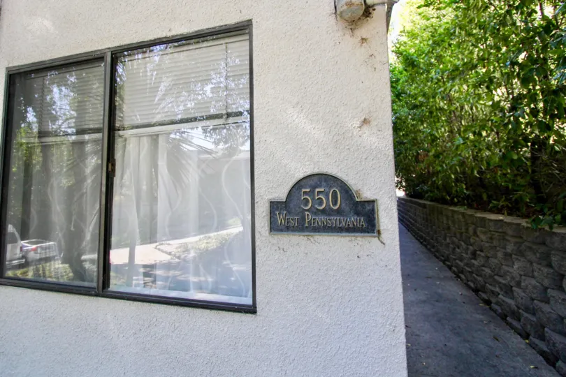 Beautiful House with number shown and trees beside in Canyon Shadows of Hillcrest