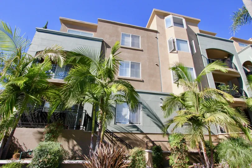 Front of the Apartment in Centre Court Condominiums has plants and trees