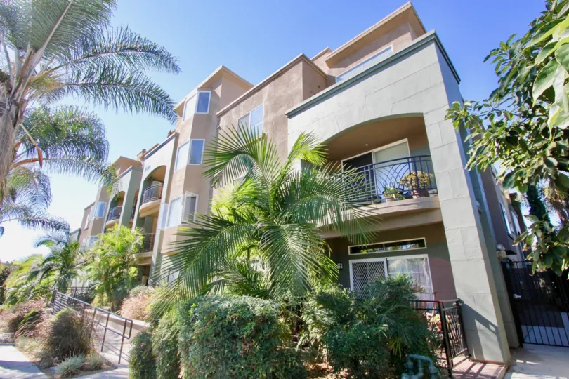 Villas with trees having sunshine and a balcony in Center Court of Condominiums of Hillcrest