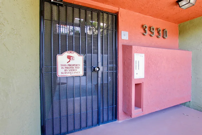 An entrance of a building in the Centre Park Terrace with numeric sign.