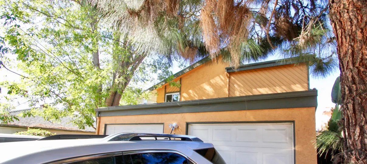 A sunny day in the area of Centre St, outside, car, garage, trees, condos