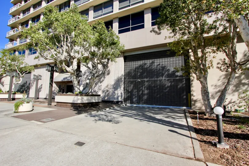 Trees are placed in front of the apartment in Century Plaza Towers