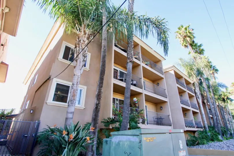 A sunny day in the Cliffbridge Estates with residential building and trees.