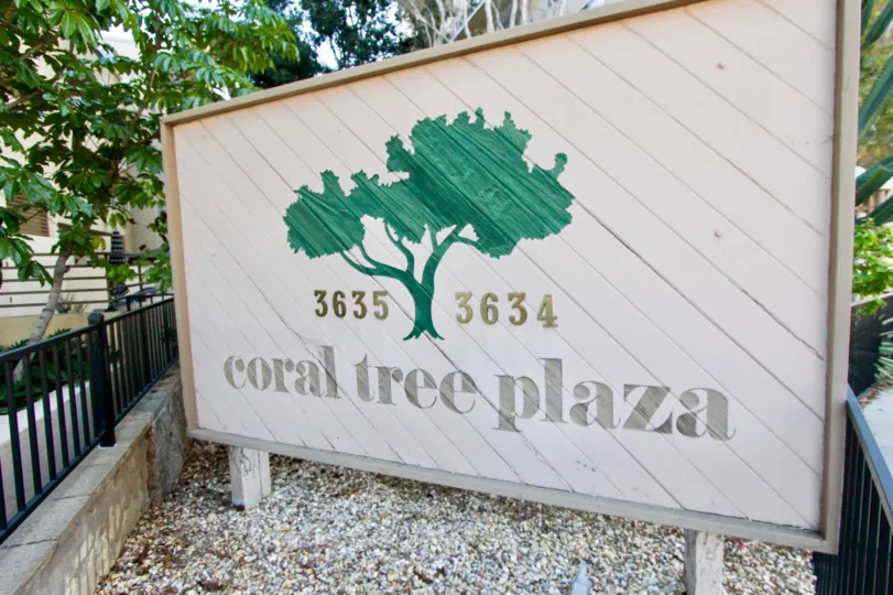 THE 3634, 3635 APARTMENTS IN THE CORAL TREE PLAZA WITH THE CORAL TREE PLAZA BOARD, TREES, PLANTS