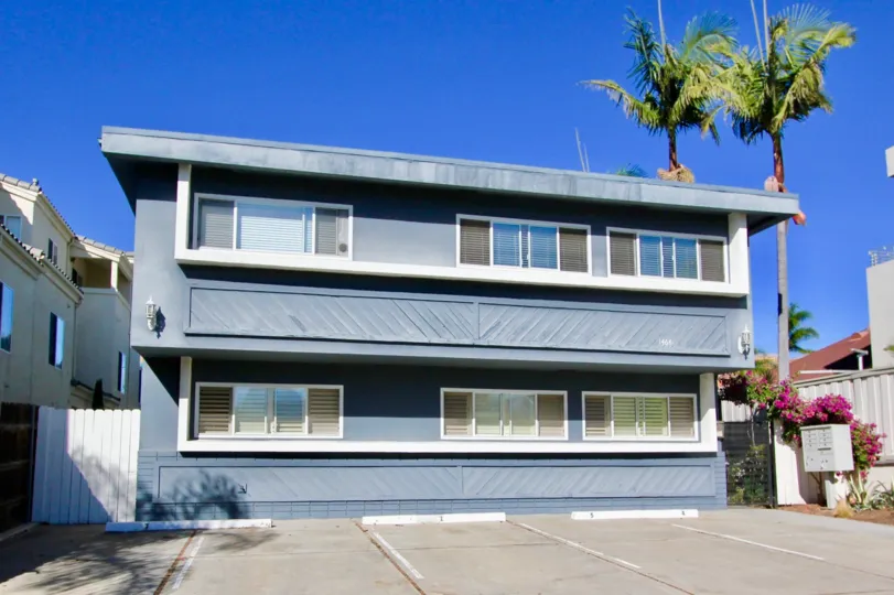 Fabulous view of a house with palm trees and parking in Essex Manor of Hillcrest