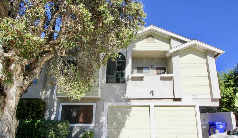 Two gray garages below a condominium home in Essex Street Condos at Hillcrest CA