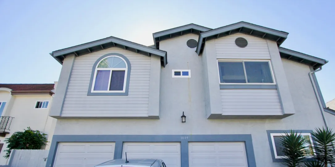THE 1009 APARTMENT IN THE FORECAST II WITH THE SHUTTERS, TREES, PLANT, CAR PARKING
