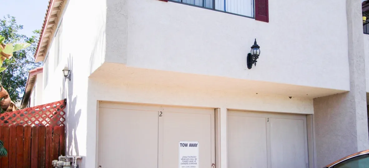 A plain two-storey residence with a closed garage in Georgia Heights neighborhood.