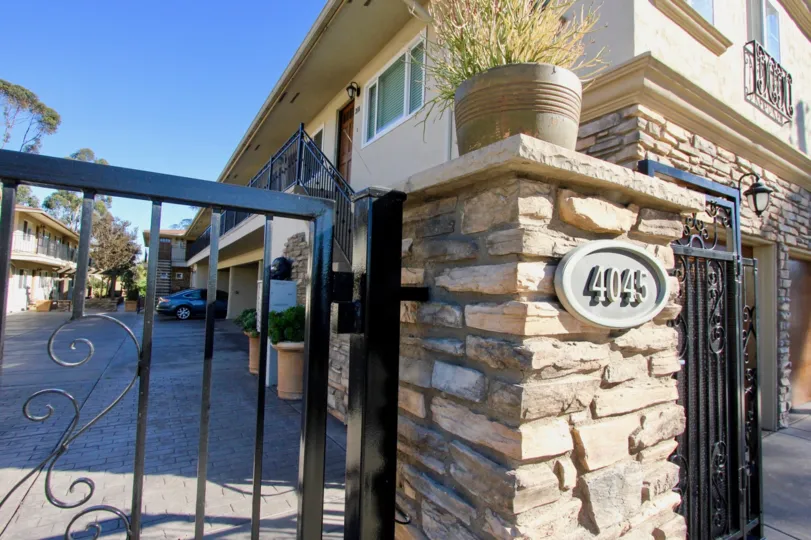 Front gate and parking area at the Hillcrest 19 community in Hillcrest, California