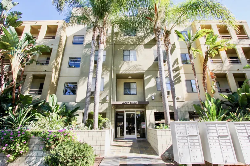 Hillcrest Palms multi-story apartment condo creme building Hillcrest California