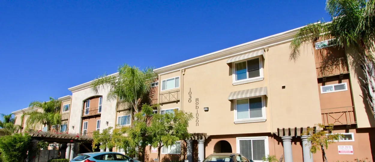 The Hillcrest Towers with number of side windows and tall trees around