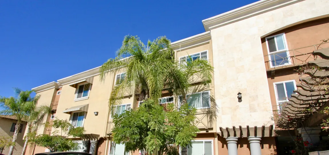 The Hillcrest Towers with number of side windows and tall trees around