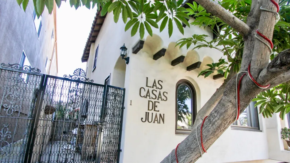 A sunny day in the area of Las Casas de Juan, condos, outside, palm trees, windows, balcony