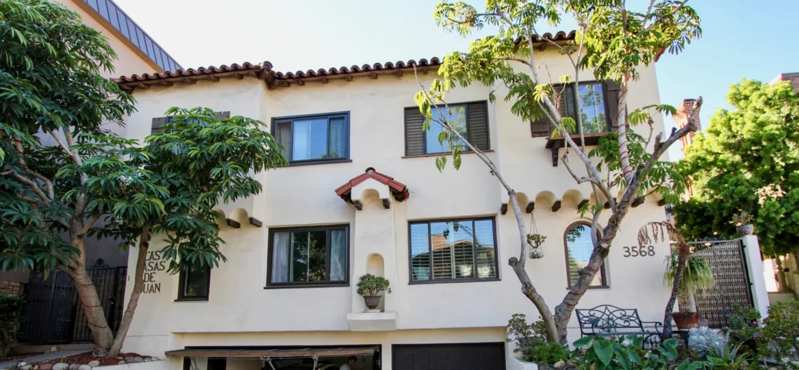 A sunny day in the Las Casas de Juan with residential building and trees.