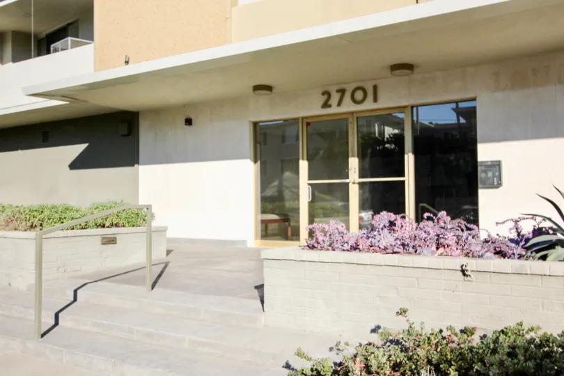 A sunny day in the area of Laurel Hill, condo, glass door, buzzer, flowers, balcony