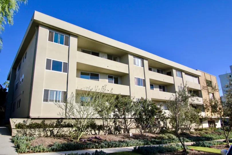 A sunny day in the Laurel Hill with residential apartment and trees.