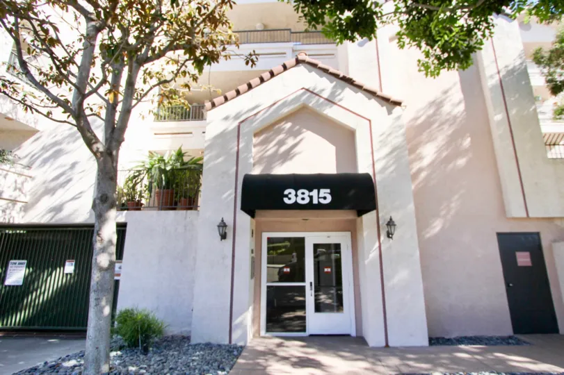 The Building with number 3815 and has light lamps is attached both side to the wall