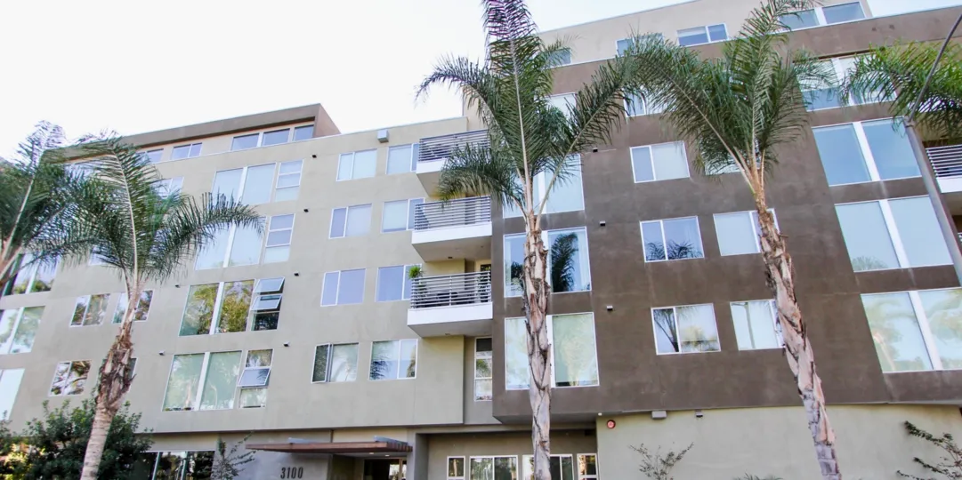 A multi-story apartment with brown motif in the Park at Sixth neighborhood.