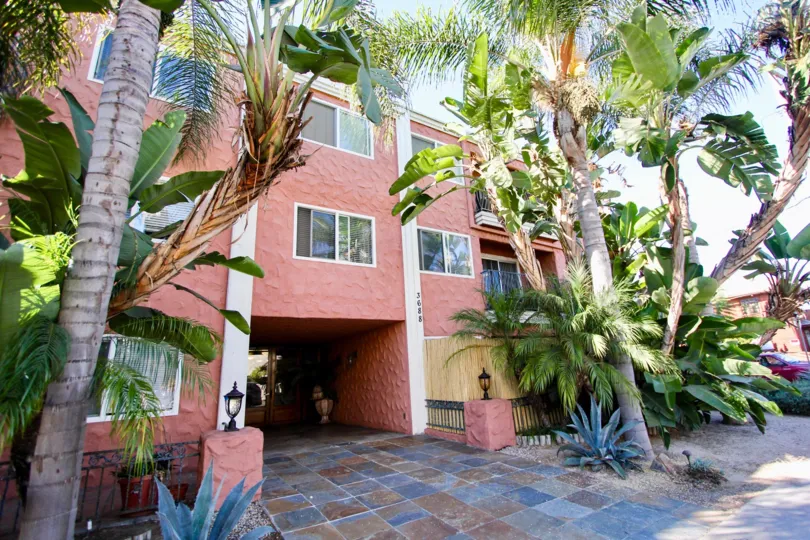 An entrance of a building in the Terrace Village with beautiful plants.