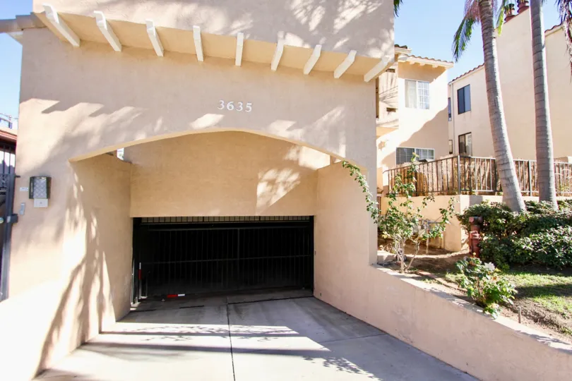 The entrance to an underground parking with decorative eaves in the Third Avenue Condos community.