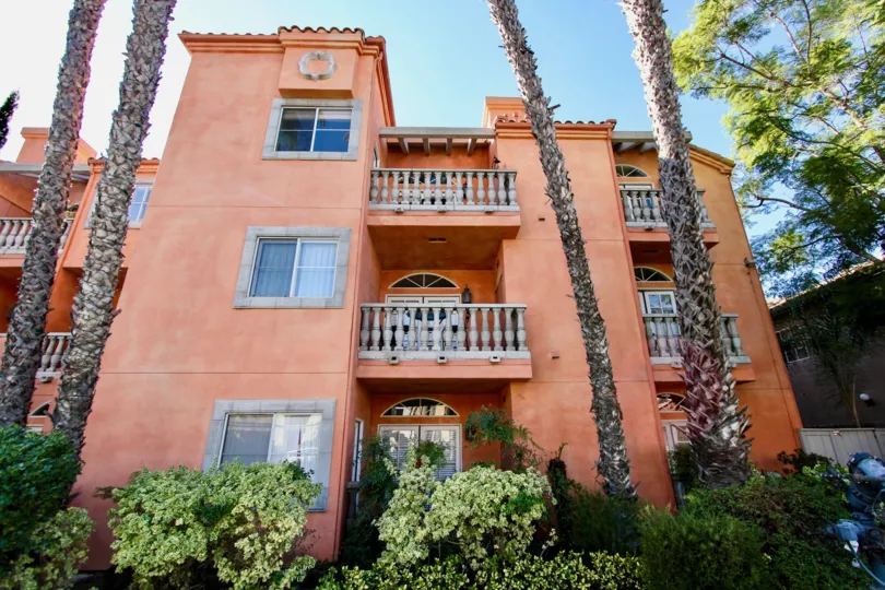 In Front at the Entrance of the apartment in Trevi Villa has tall trees and plants