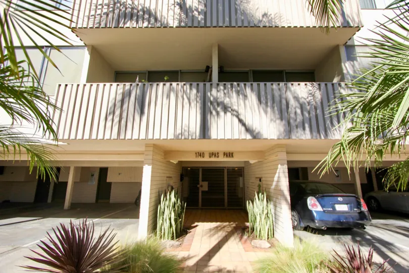 A sunny day with carparking and trees in front of villa in Upas Park of Hillcrest