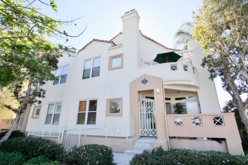 THE HOME IN THE UPTOWN CREST WITH THE UMBRELLA, UPSTAIRS, PLANTS, TREES, STEEL GATE
