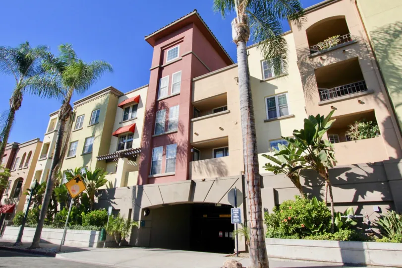 An apartment in the Uptown District with plants and trees.