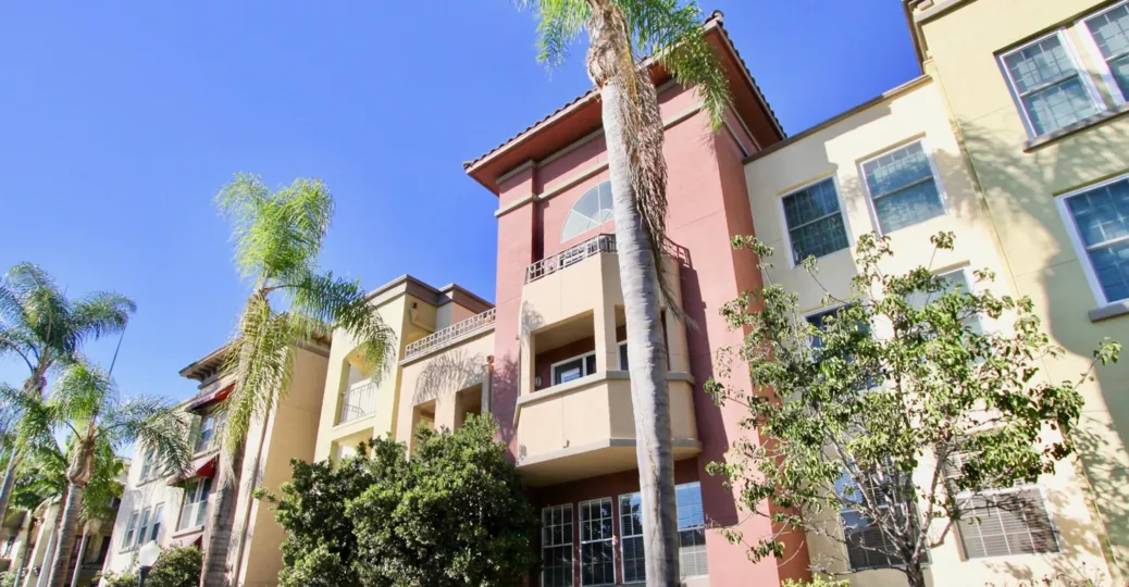 Bright sunny day with gree trees in front of a Villa in Uptown District of Hillcrest
